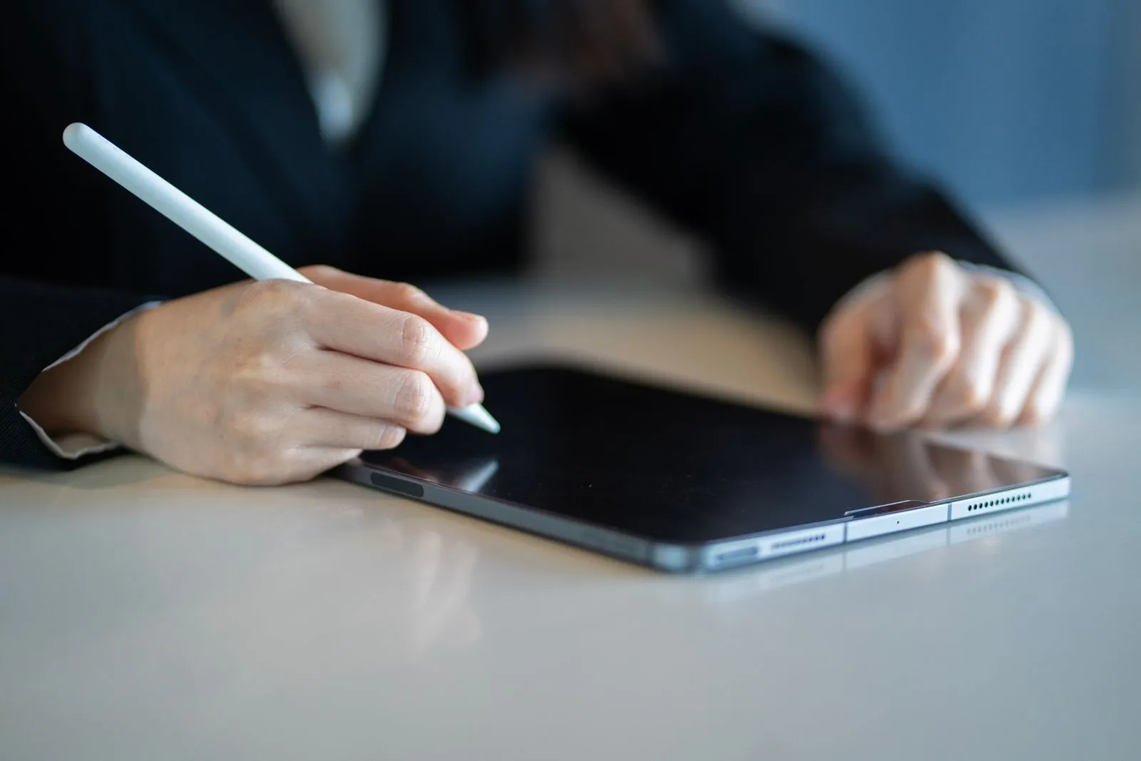 A professional reviewing financial paperwork, representing the choice between a cash deposit and a surety policy