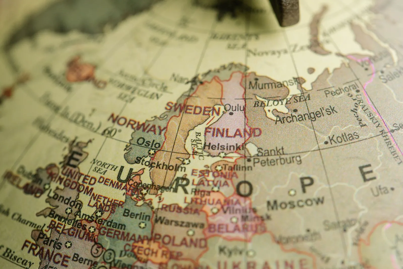 Close-up of a vintage globe showing northern and central Europe, from the United Kingdom and France to Scandinavia, Poland and the Baltic states